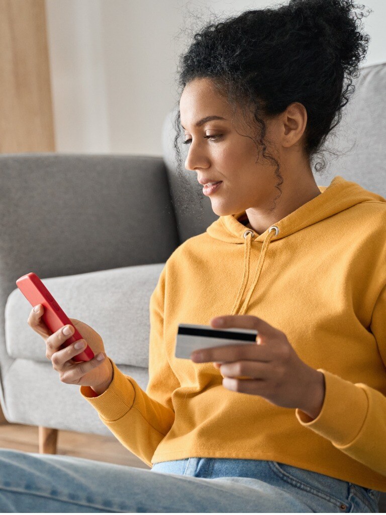 young-adult-african-american-girl-sitting-indoors-doing-mobile-payment-online.jpg_s=1024x1024&w=is&k=20&c=rOd6Fk5jaRKm89ll7TH5nifcS95G3Ieow6H0-WdmXjY=